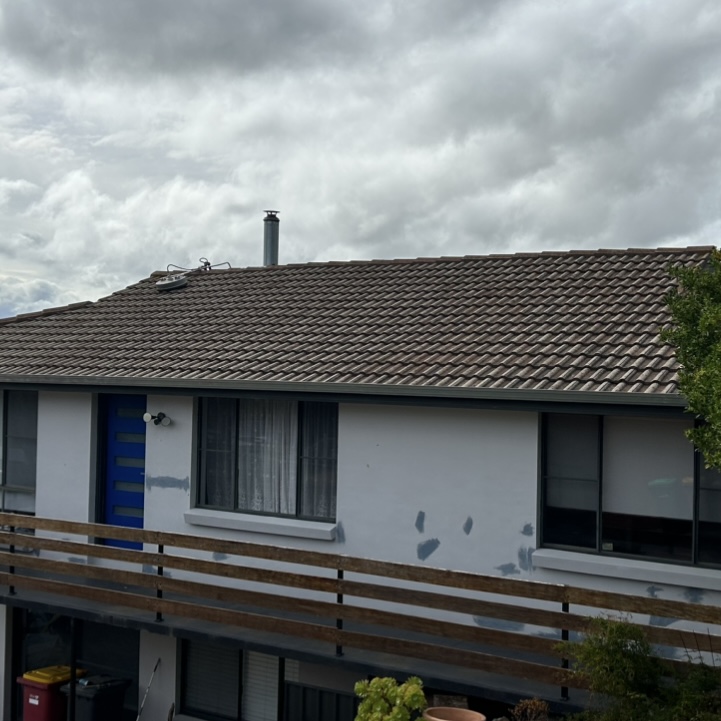 Aged tile roof before restoration